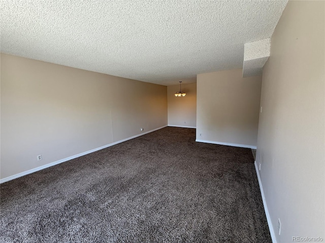 7695 E Quincy Ave Unit 207, Denver, CO 80237 - unfurnished room with a chandelier, dark colored carpet, and a textured ceiling