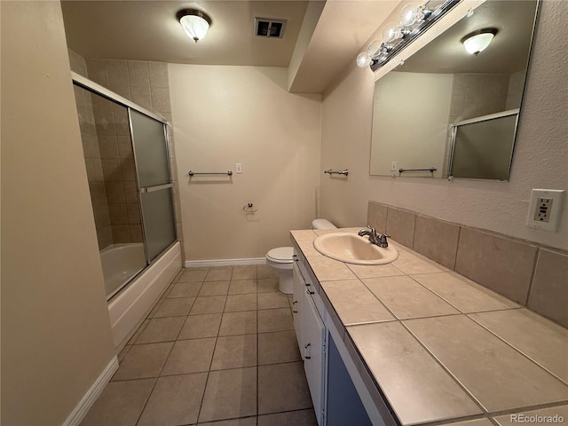 7695 E Quincy Ave Unit 207, Denver, CO 80237 - bathroom with vanity, tile patterned flooring, and shower / bath combination with glass door