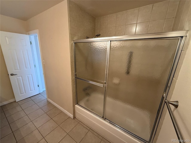 7695 E Quincy Ave Unit 207, Denver, CO 80237 - bathroom featuring tile patterned floors and enclosed tub / shower combo
