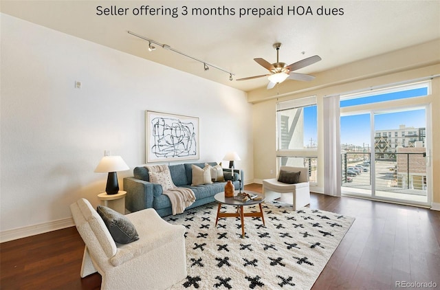 2460 W 29th Ave Unit 204, Denver, CO 80211 - living area featuring track lighting, ceiling fan, dark wood finished floors, and baseboards