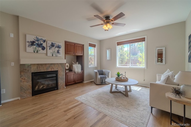2908 Open Sky Way, Castle Rock, CO 80109 - living room featuring ceiling fan, a premium fireplace, and light wood finished floors