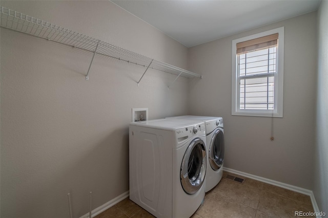 2908 Open Sky Way, Castle Rock, CO 80109 - laundry room featuring washing machine and dryer and light tile patterned floors