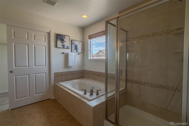 2908 Open Sky Way, Castle Rock, CO 80109 - bathroom with a shower stall, a garden tub, and tile patterned flooring