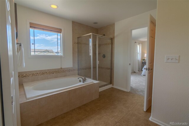2908 Open Sky Way, Castle Rock, CO 80109 - bathroom featuring a bath, a shower stall, and tile patterned floors