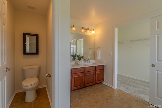 2908 Open Sky Way, Castle Rock, CO 80109 - bathroom featuring vanity, tile patterned floors, and a walk in closet