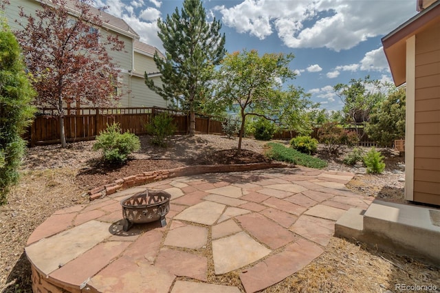 2908 Open Sky Way, Castle Rock, CO 80109 - fenced backyard featuring a fire pit and a patio