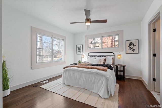 bedroom featuring dark wood-type flooring and ceiling fan