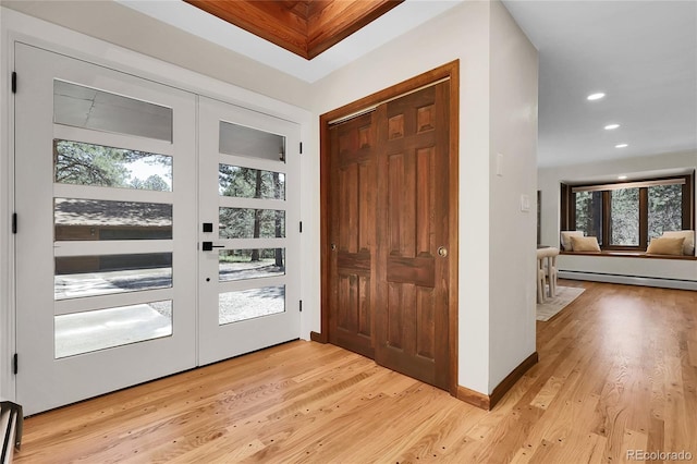 8782 S Ault Ln, Morrison, CO 80465 - foyer with plenty of natural light, light wood-style floors, recessed lighting, and a baseboard heating unit