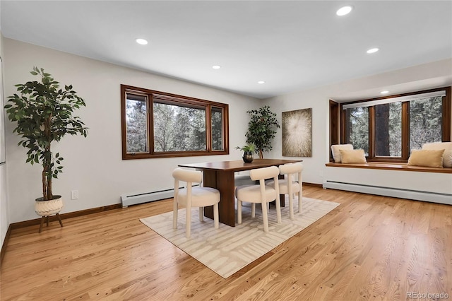 8782 S Ault Ln, Morrison, CO 80465 - dining space featuring a baseboard radiator, a baseboard heating unit, light wood-style flooring, recessed lighting, and baseboards