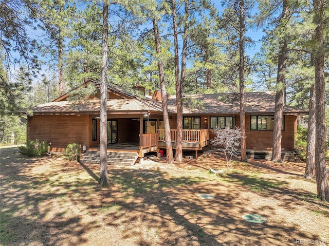 8782 S Ault Ln, Morrison, CO 80465 - back of property featuring a chimney and a porch