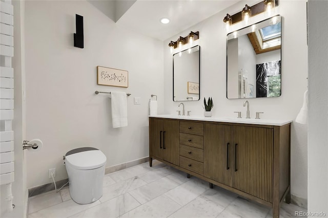 8782 S Ault Ln, Morrison, CO 80465 - full bath with marble look tiles, baseboards, double vanity, and toilet