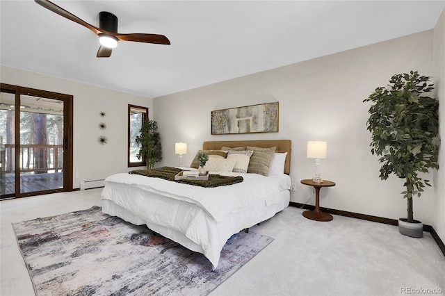 8782 S Ault Ln, Morrison, CO 80465 - bedroom with carpet floors, baseboards, a baseboard heating unit, a ceiling fan, and access to exterior