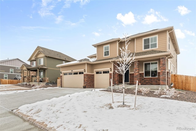 view of front of home with fence and brick siding