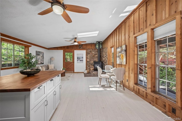 41 Silver Spruce, Boulder, CO 80302 - sunroom / solarium with a wood stove, vaulted ceiling, and a skylight