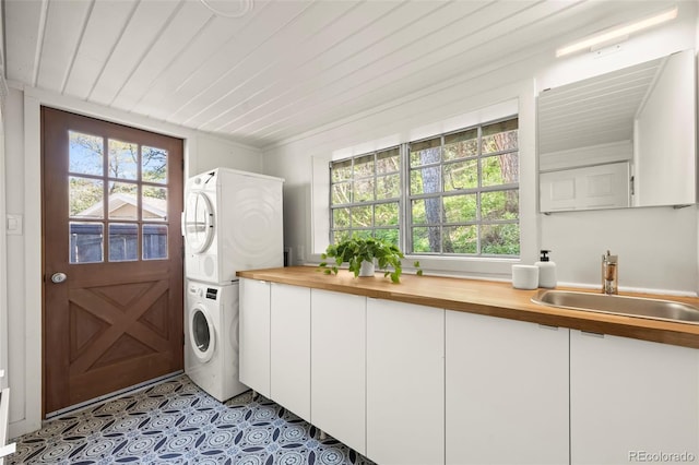 41 Silver Spruce, Boulder, CO 80302 - laundry area featuring stacked washer / dryer, cabinet space, and wood ceiling