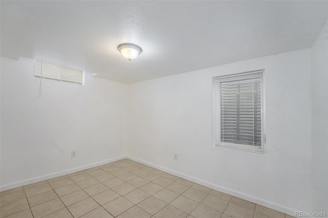 spare room featuring a textured ceiling