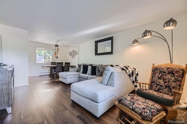 living room with baseboard heating and dark hardwood / wood-style flooring