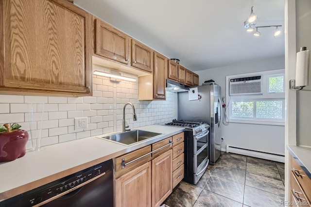 kitchen with tasteful backsplash, baseboard heating, sink, appliances with stainless steel finishes, and an AC wall unit