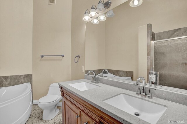 full bathroom with vanity, plus walk in shower, and toilet