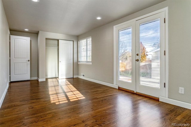 5500 Holland Dr, Arvada, CO 80002 - unfurnished bedroom featuring access to outside, baseboards, dark wood finished floors, recessed lighting, and a closet