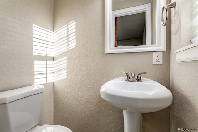 5500 Holland Dr, Arvada, CO 80002 - bathroom featuring toilet and a textured wall