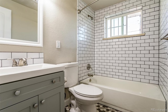 5500 Holland Dr, Arvada, CO 80002 - full bath featuring toilet, shower / bathtub combination, vanity, and a textured wall