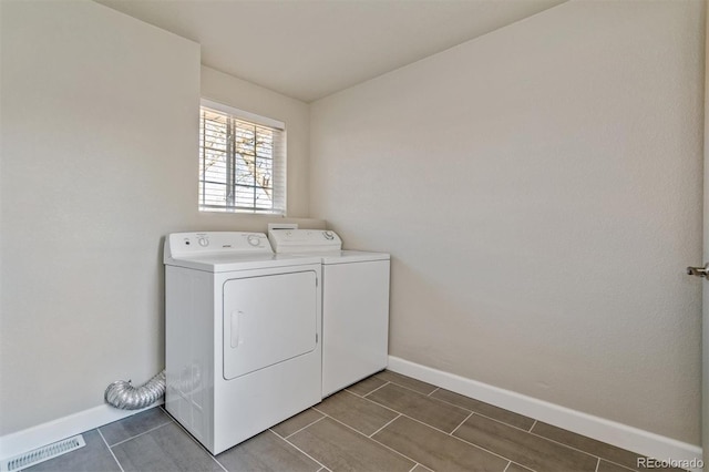 5500 Holland Dr, Arvada, CO 80002 - laundry area with washer and clothes dryer and baseboards