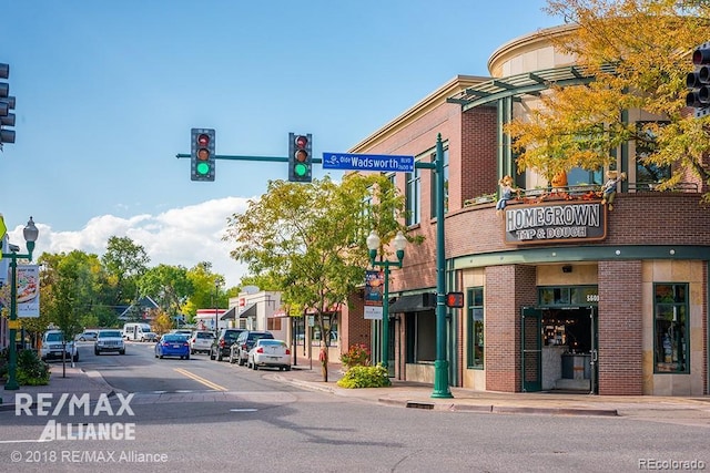 5500 Holland Dr, Arvada, CO 80002 - view of asphalt street with traffic lights, sidewalks, and street lights