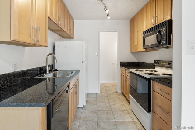 850 20th St Unit 201, Boulder, CO 80302 - kitchen featuring black appliances, a sink, light tile patterned floors, a textured ceiling, and dark stone counters