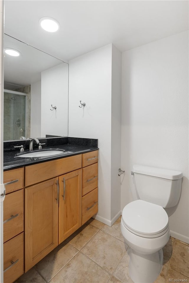 850 20th St Unit 201, Boulder, CO 80302 - full bath with vanity, toilet, a stall shower, baseboards, and tile patterned floors
