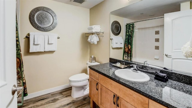 bathroom with a shower with shower curtain, wood-type flooring, vanity, and toilet