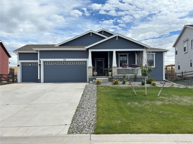 craftsman-style home featuring a porch, a garage, and a front lawn