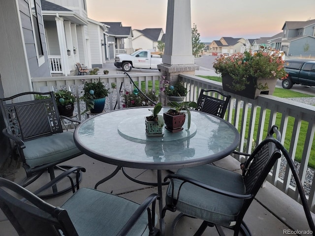 balcony at dusk with covered porch