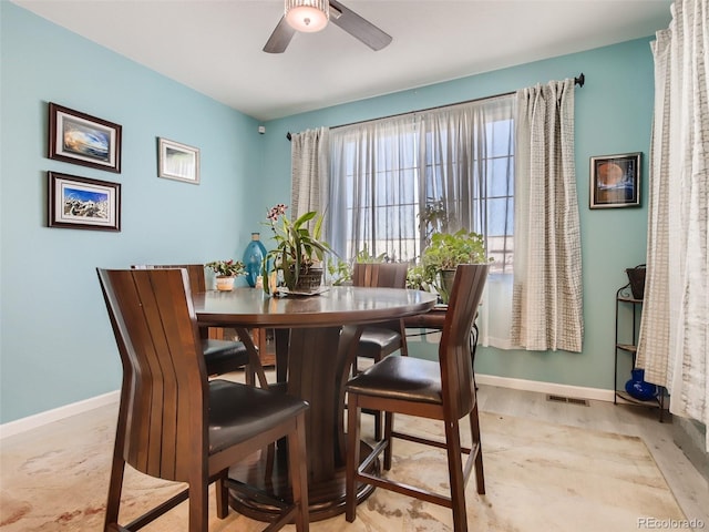 dining space featuring ceiling fan and light hardwood / wood-style flooring