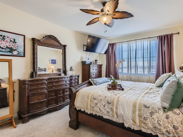 carpeted bedroom with ceiling fan