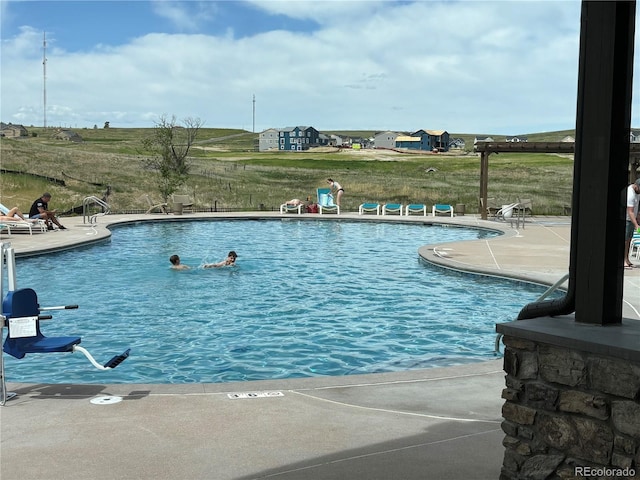 view of swimming pool with a patio area