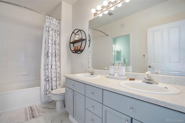 full bathroom featuring shower / bath combo with shower curtain, vanity, and toilet