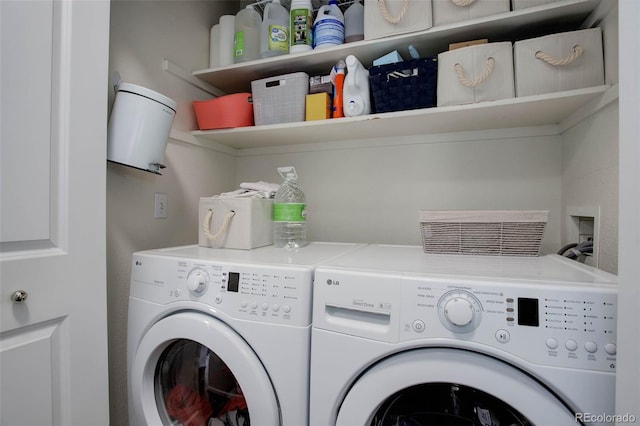 laundry area with washing machine and clothes dryer