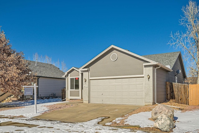 ranch-style home with a garage