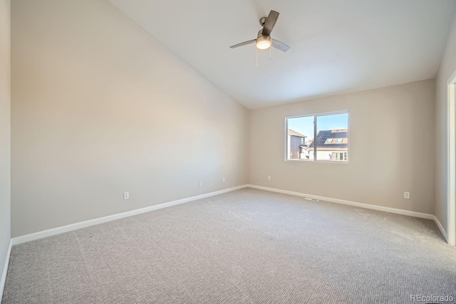 unfurnished room with vaulted ceiling, ceiling fan, and carpet flooring