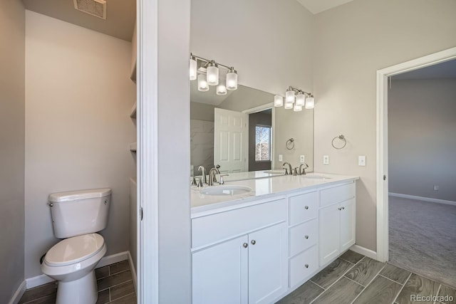 bathroom with vanity and toilet