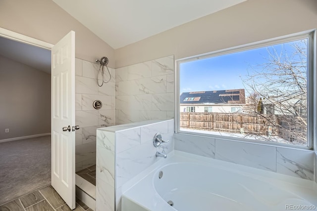 bathroom with vaulted ceiling and plus walk in shower