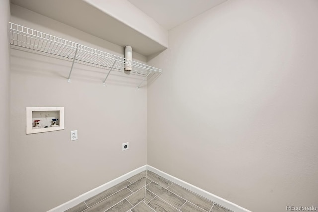 clothes washing area featuring hookup for a washing machine and electric dryer hookup