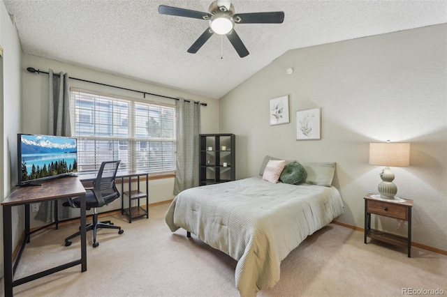 bedroom with lofted ceiling, baseboards, a textured ceiling, and carpet