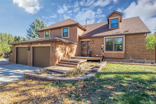 view of front of house with a garage and a front lawn