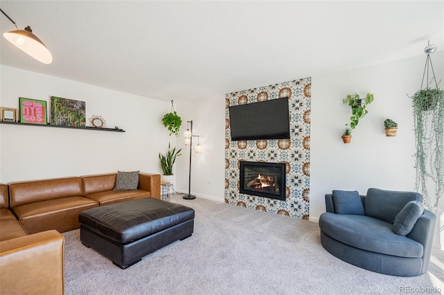 living room featuring carpet flooring and a tile fireplace