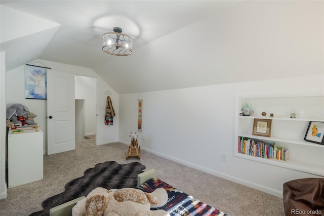 interior space with lofted ceiling and light colored carpet