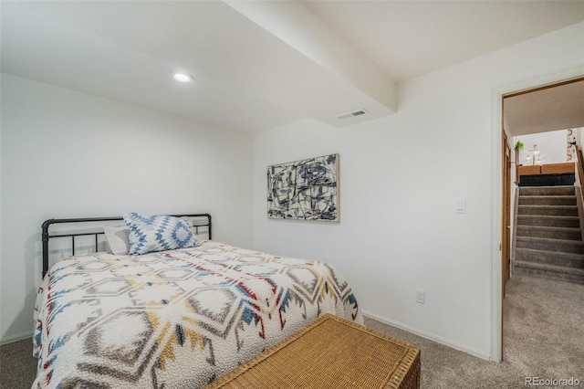 bedroom with carpet and a walk in closet