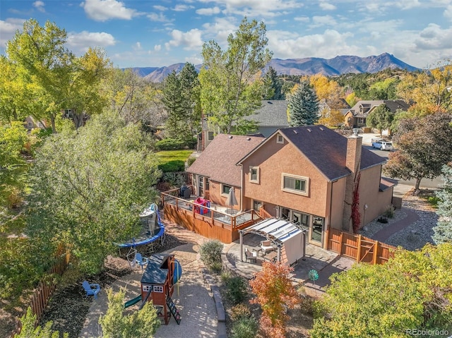 birds eye view of property featuring a mountain view