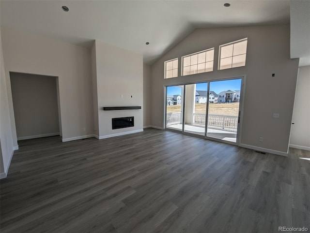 unfurnished living room with dark wood-type flooring